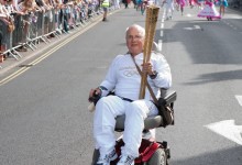 Local Olympic Torch Bearer at the Lord Mayor's Street Procession, 2012
