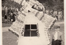 Christopher Denton dressed as 'The Land of Bloom' with a windmill at Northampton Carnival, c.1954