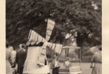 Christopher Denton dressed as 'The Land of Bloom' with a windmill at Northampton Carnival, c.1954