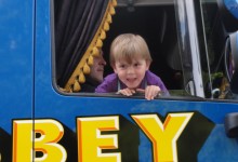 Child in cab of a float at Lord Mayor's Street Procession 2012