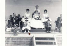 Carnival Queen being crowned by Yana, with carnival court, 1962