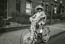 Participant on a decorated bicycle at the Albany Road Carnival, 1924