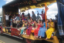 People sitting on the Sikh Community Centre and Youth Club float.