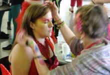 Make up being put on a participant before Hitchin Carnival, 2012