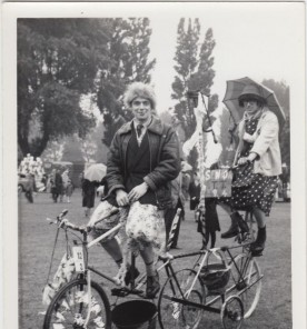 Two men dressed as ladies on a tandem bicycle, 1964