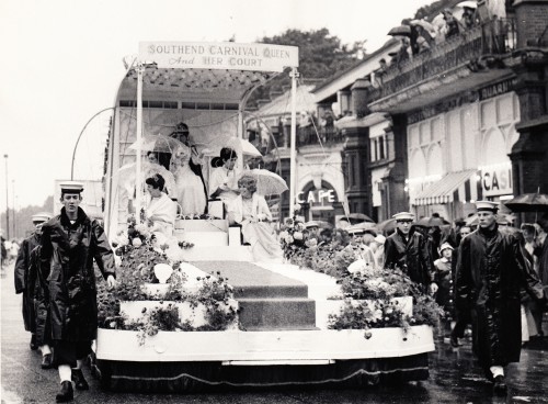 Black and white photo of people dressed up on a carmival float (picture2_0c8f80b301)